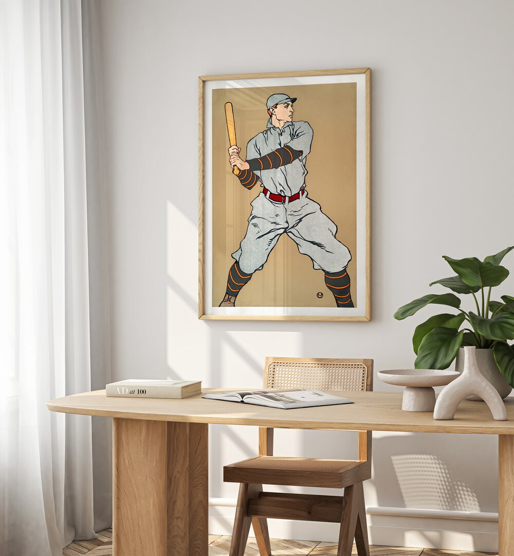 Vintage Drawing Of A Baseball Player Holding A Bat 1908 Vintage Paintings in Oak Wood Plain Frame placed on a wall behind a study table