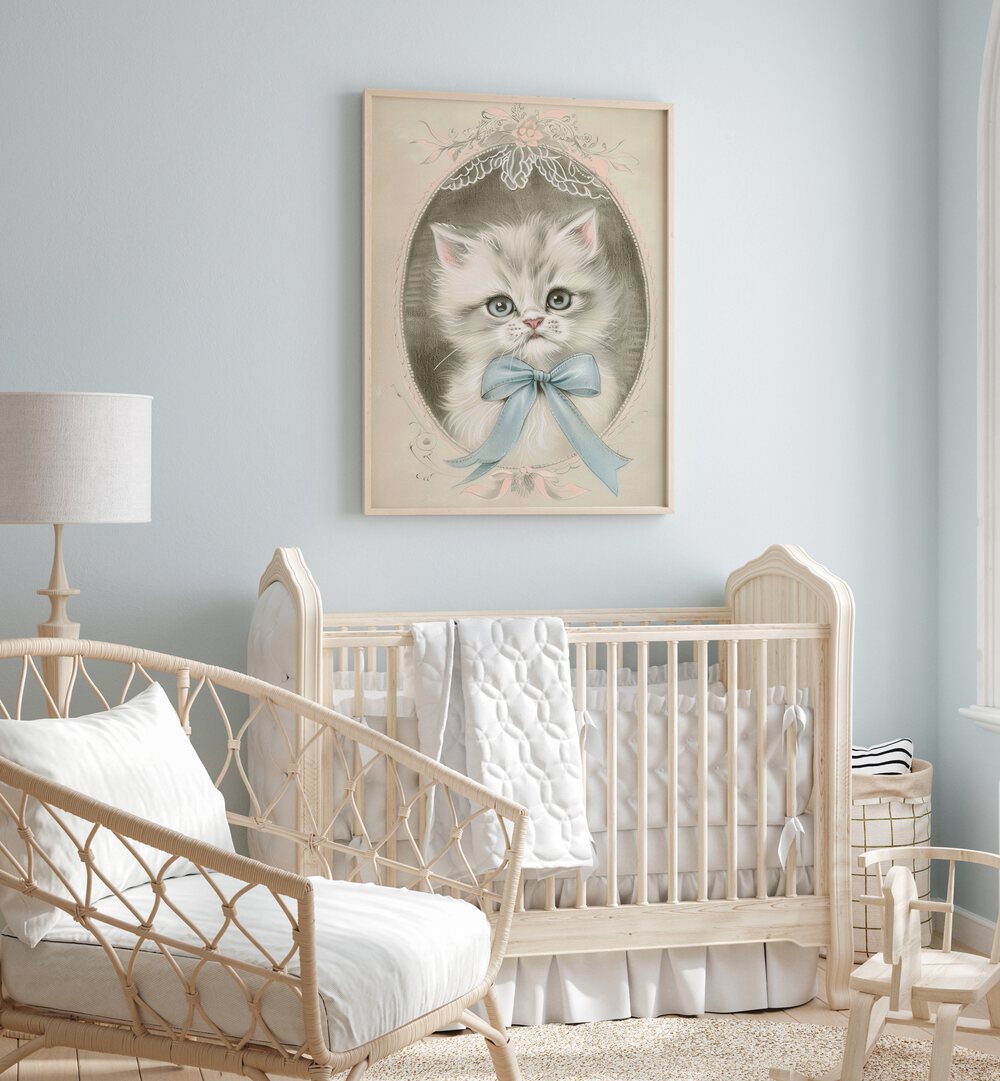 Vintage Kitten Kids Room Paintings Kids Room Wall Art in Oak Wood Plain Frame placed on a wall in a kids room behind an infant's bed