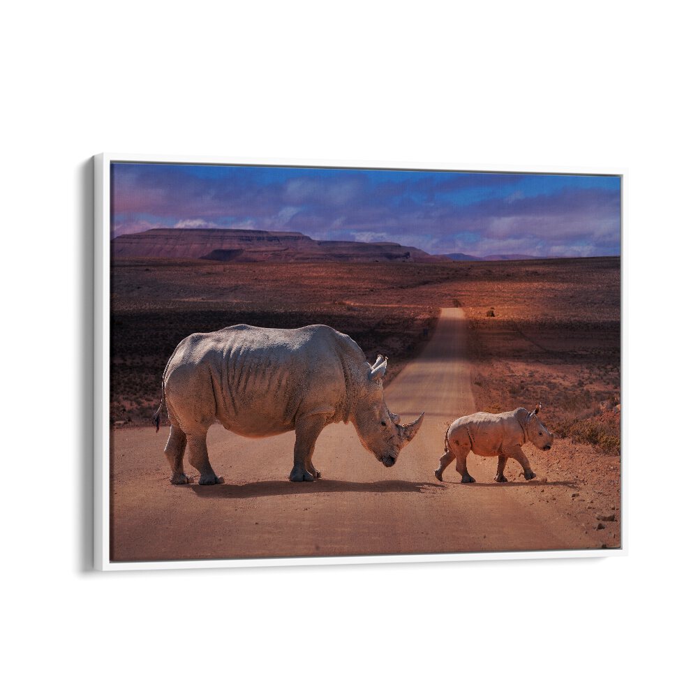 Rhinos crossing a dusty road, showcasing the beauty of wildlife in RHINOS CROSSING, PHOTOGRAPHY PRINTS.