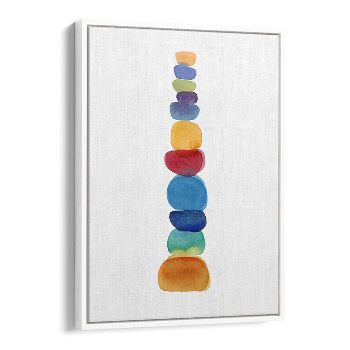 Brightly colored stacked stones create a serene atmosphere in the COLOR TOWER, BEACH PAINTINGS collection.