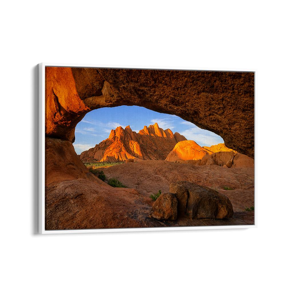 Stunning view of Spitzkoppen framed by rocks, perfect for your collection of SPITZKOPPEN, PHOTOGRAPHY PRINTS.
