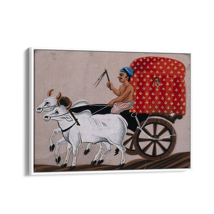 A MAN DRIVING A BULLOCK