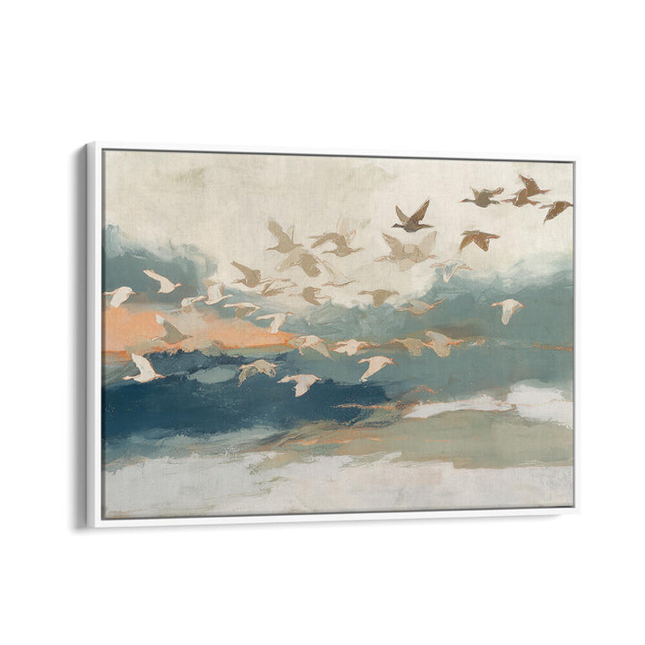 BIRDS IN FLIGHT AT DUSK OVER OPEN WATER