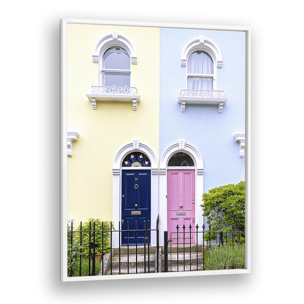 Charming DOORS OF LONDON, PHOTOGRAPHY PRINTS featuring vibrant blue and pink doors against pastel walls. Perfect for decor.