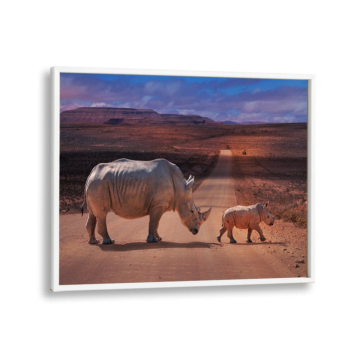 Majestic rhinos crossing a road, showcasing the beauty of wildlife in RHINOS CROSSING, PHOTOGRAPHY PRINTS.