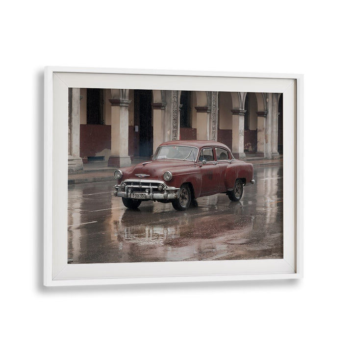 Classic car reflecting in rain-soaked streets, perfect for DRIVING BY RAIN, PHOTOGRAPHY PRINTS collection.