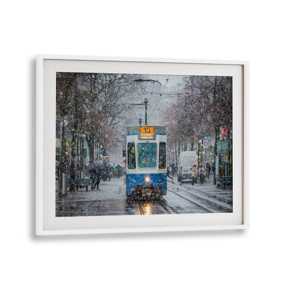 Tram navigating through snowy Zurich streets, capturing the essence of "MORNING IN ZURICH , PHOTOGRAPHY PRINTS."