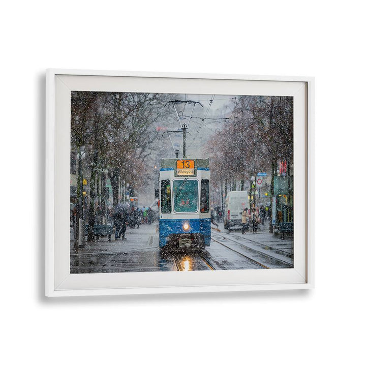 Tram navigating through snowy Zurich streets, capturing the essence of "MORNING IN ZURICH , PHOTOGRAPHY PRINTS."