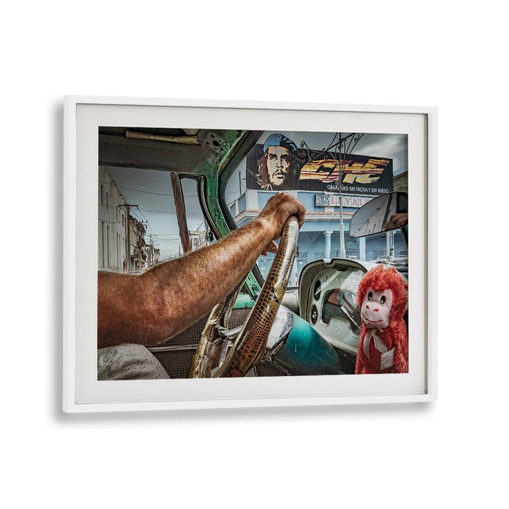Vintage street scene featuring a driver’s hand and playful monkey, showcasing CHE AND THE TAXIDRIVER, PHOTOGRAPHY PRINTS.