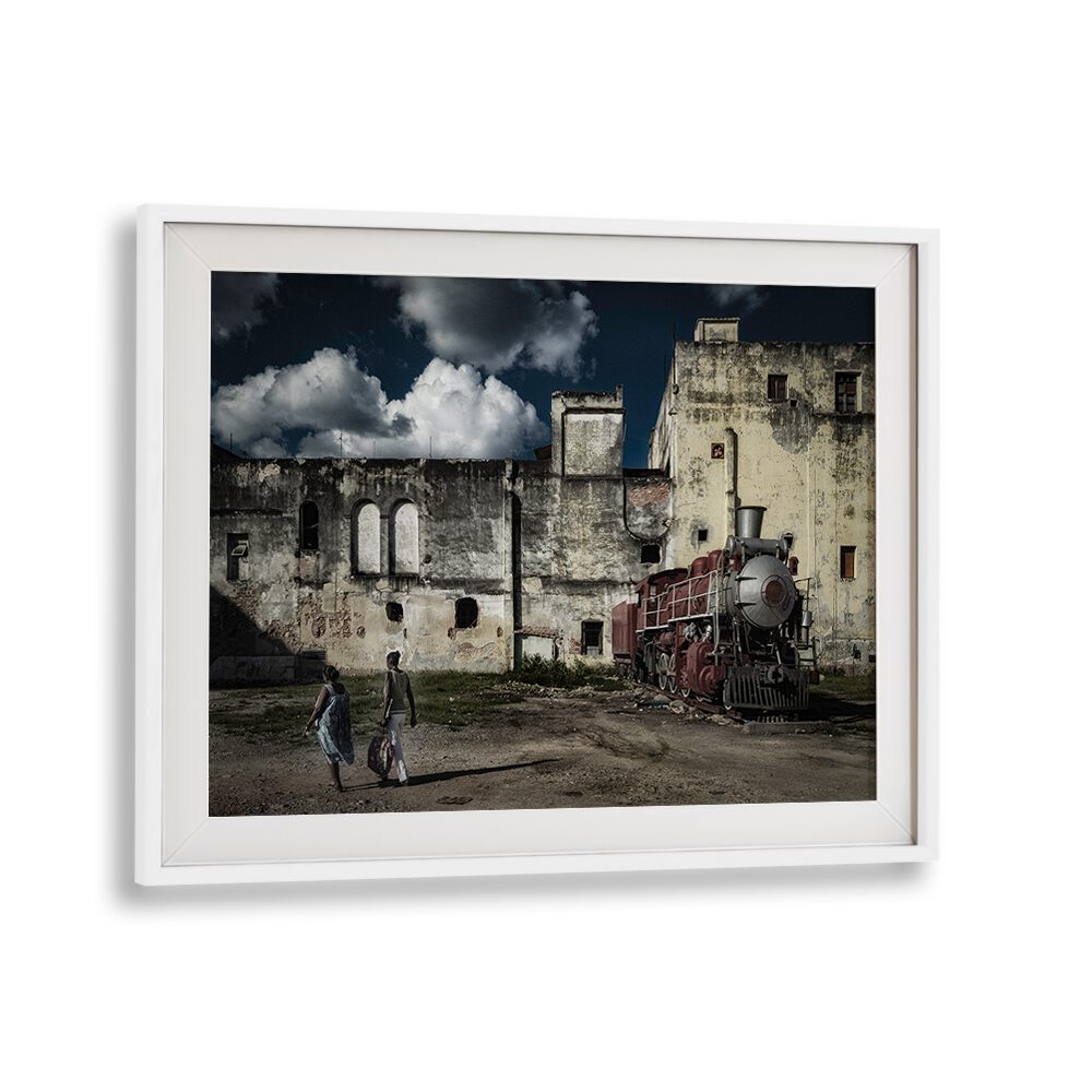 Explore urban life with HAVANA TRAIN, PHOTOGRAPHY PRINTS featuring a vintage train against a historic backdrop.