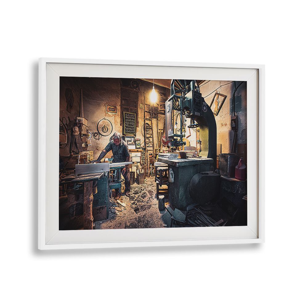 Craftsman at work in a workshop, showcasing THE CARPENTER'S WORKSHOP, PHOTOGRAPHY PRINTS collection.