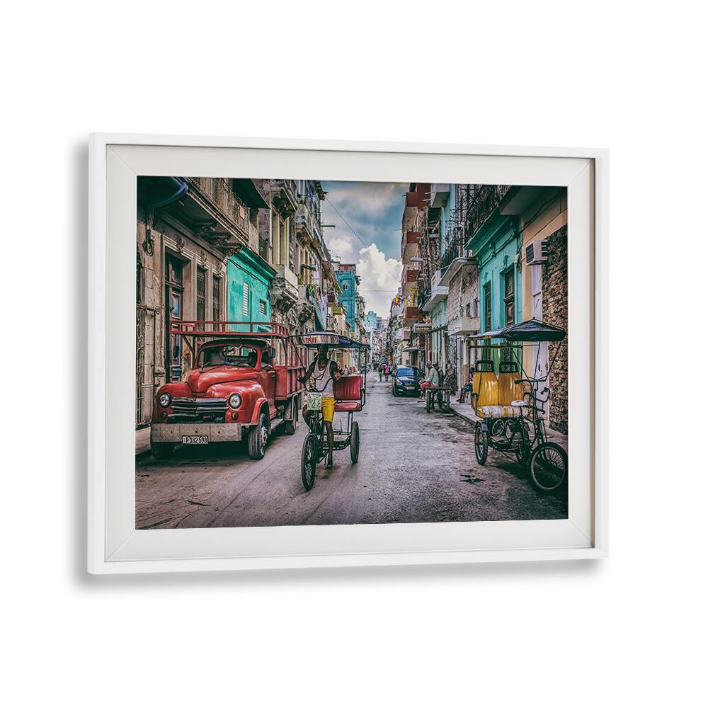 Vibrant street scene from Havana featuring bikes and classic cars, showcasing HABANA STREET XII, PHOTOGRAPHY PRINTS.