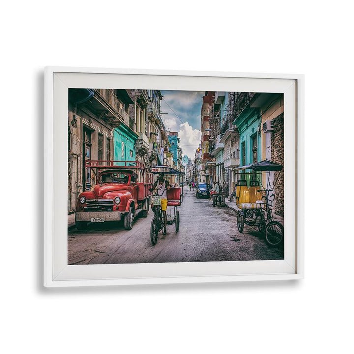 Vibrant street scene from Havana featuring bikes and classic cars, showcasing HABANA STREET XII, PHOTOGRAPHY PRINTS.