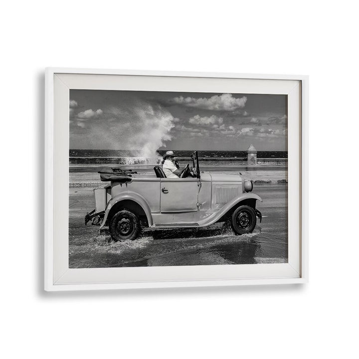 Classic vehicle splashes through waves, capturing urban essence in MALECON, PHOTOGRAPHY PRINTS for timeless art.