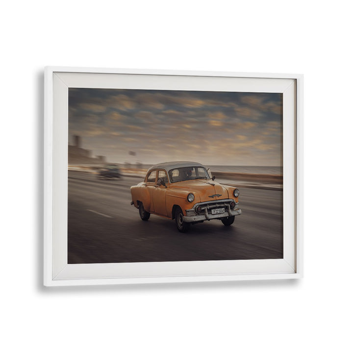 Capture the essence of street life with MALECON VII, PHOTOGRAPHY PRINTS featuring a classic car in motion.