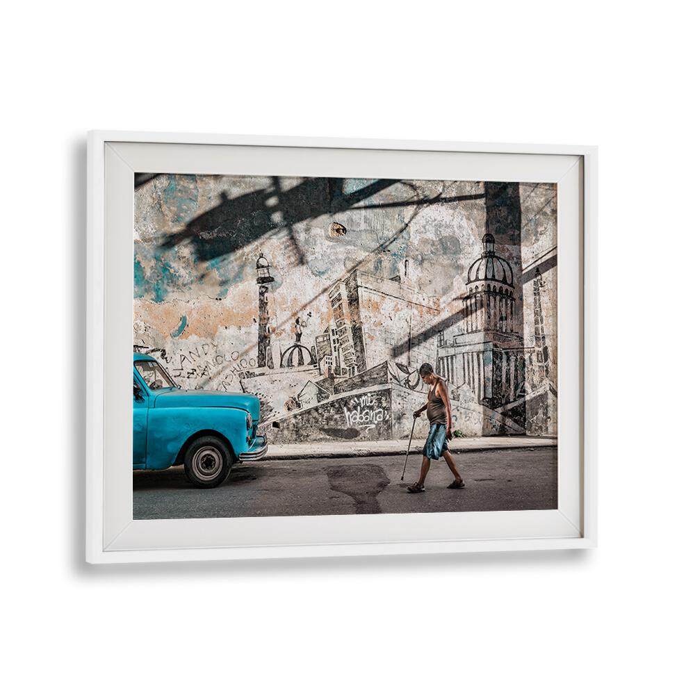 Vibrant HI HABANA, PHOTOGRAPHY PRINTS showcasing a man walking past a classic car and stunning street art in Havana.