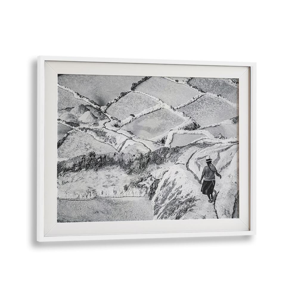 Captivating landscape featuring a lone figure walking through the iconic SALINAS MARAS, PHOTOGRAPHY PRINTS collection.
