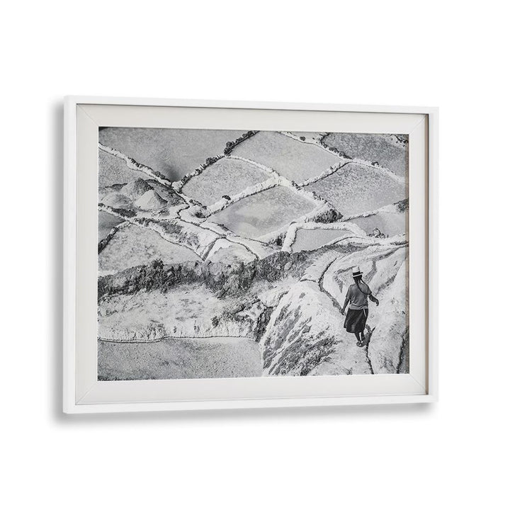 Captivating landscape featuring a lone figure walking through the iconic SALINAS MARAS, PHOTOGRAPHY PRINTS collection.