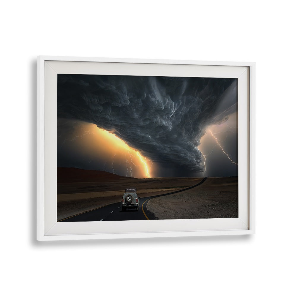 Stormy clouds loom over a winding road in this stunning STORM ROAD, PHOTOGRAPHY PRINTS, perfect for art lovers.