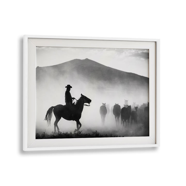 A cowboy on horseback leads a herd through fog, showcasing "HIS TERRITORY! , PHOTOGRAPHY PRINTS" in stunning detail.