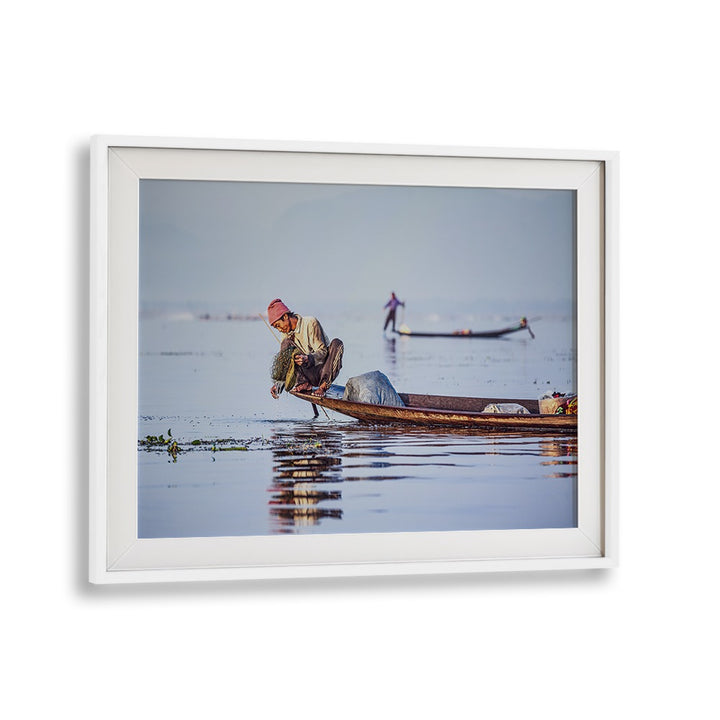 Fishermen at sunrise reflect tranquility in this captivating photography print, perfect for serene home decor.