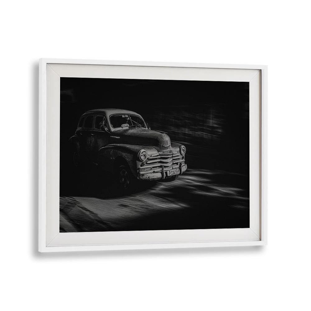 Vintage car moving through the streets, showcasing the essence of Havana in HAVANA STREET I, PHOTOGRAPHY PRINTS.