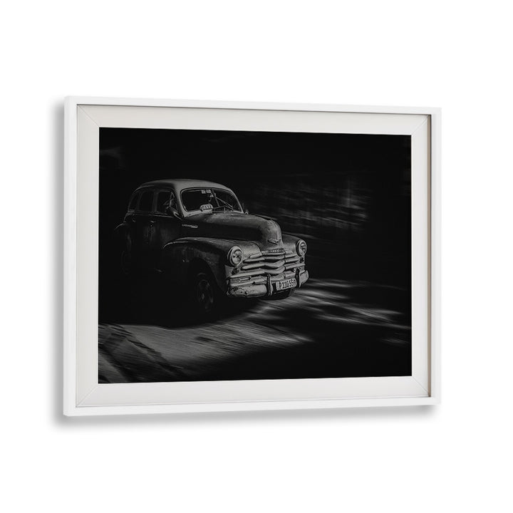 Vintage car moving through the streets, showcasing the essence of Havana in HAVANA STREET I, PHOTOGRAPHY PRINTS.