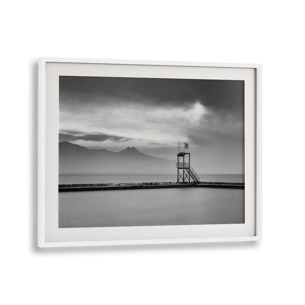 Serene black and white landscape featuring a lookout tower, perfect for AFTER THE STORM, PHOTOGRAPHY PRINTS decor.