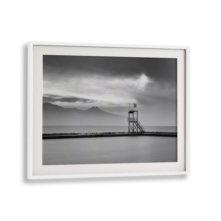 Serene black and white landscape featuring a lookout tower, perfect for AFTER THE STORM, PHOTOGRAPHY PRINTS decor.