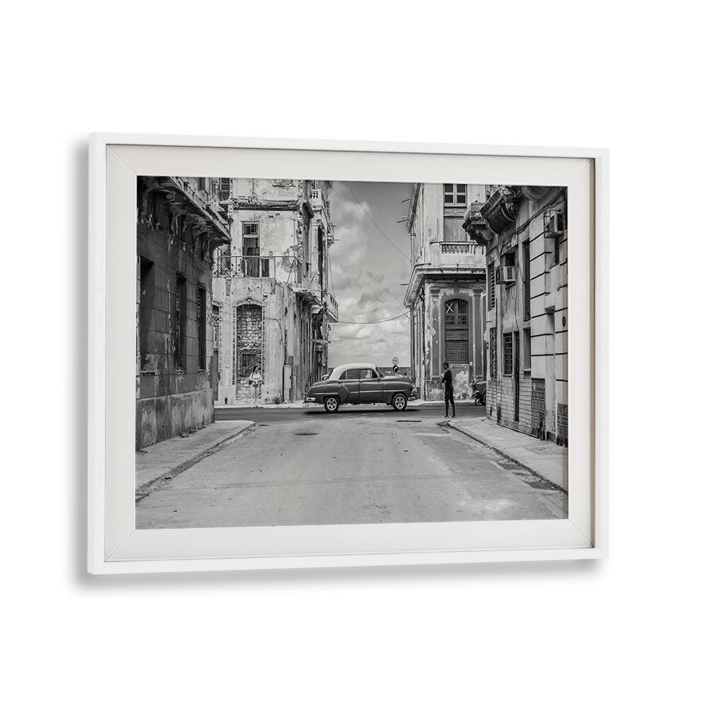 Streets of L'Avana, Photography Prints showcase a classic car on a vibrant Havana street scene, capturing urban life.