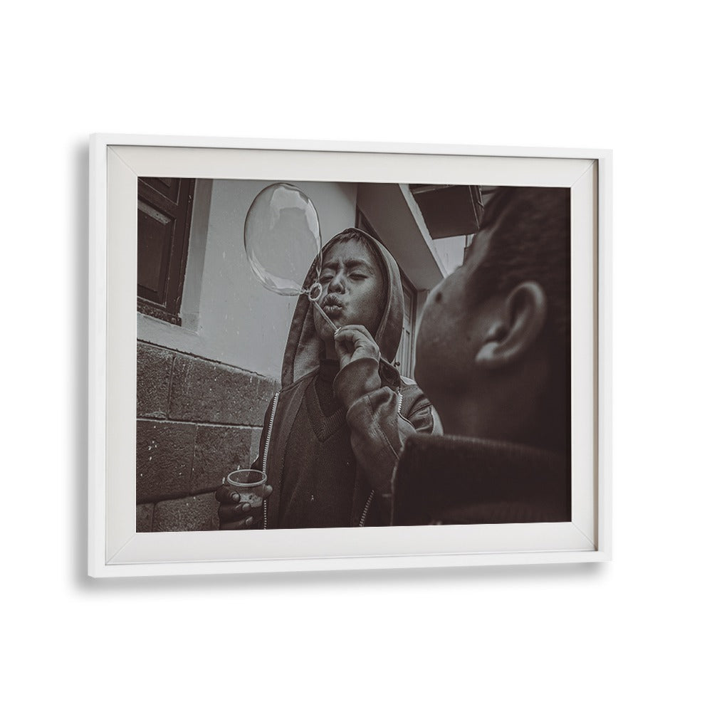 A child blowing a bubble captures the essence of urban life in CUSCO STREET, PHOTOGRAPHY PRINTS collection.