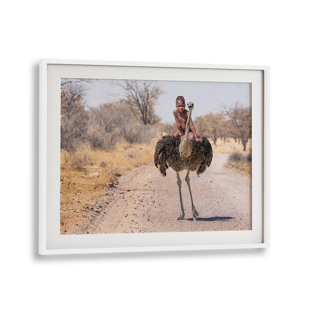 Experience the wonder of wildlife with HIMBA RIDE, PHOTOGRAPHY PRINTS showcasing a child riding an ostrich.