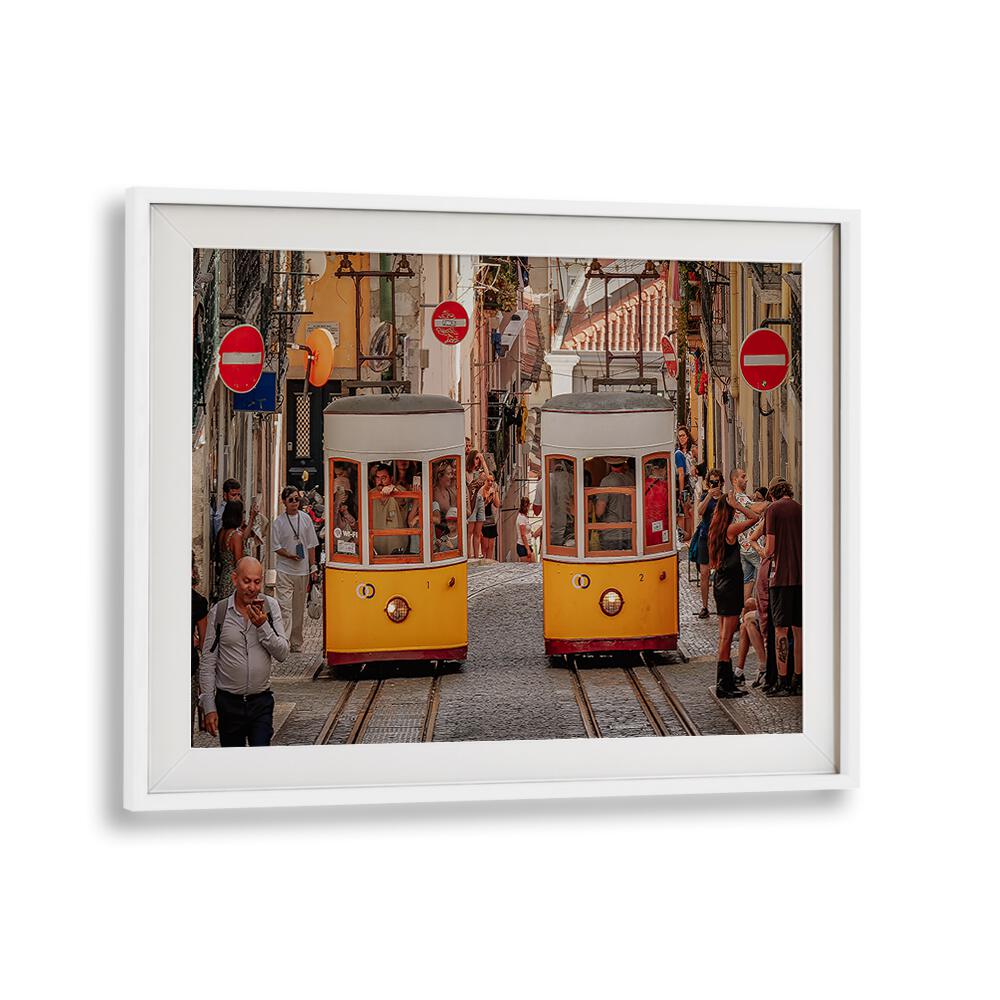 Colorful trams navigate a bustling city street, showcasing urban life in our TRAMS, PHOTOGRAPHY PRINTS collection.