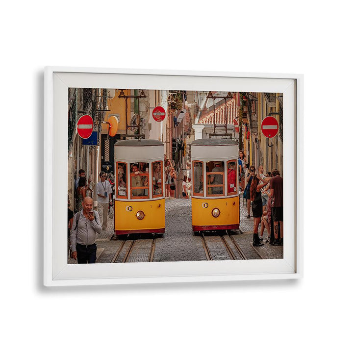 Colorful trams navigate a bustling city street, showcasing urban life in our TRAMS, PHOTOGRAPHY PRINTS collection.