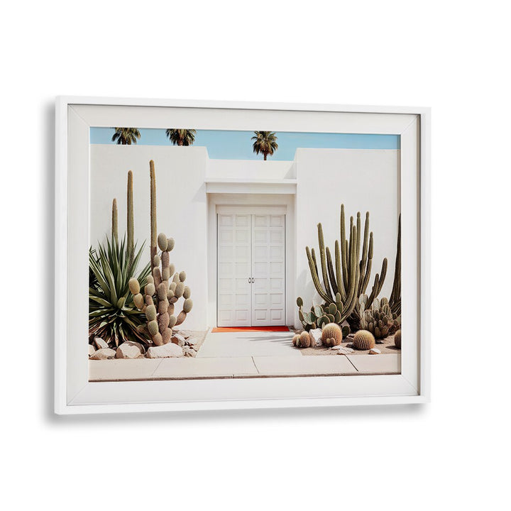 Elegant WHITE MID-CENTURY MODERN HOUSE with cacti and palms, complementing BEACH PAINTINGS for a chic decor.