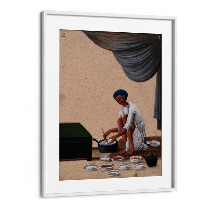 A MAN WASHING DISHES