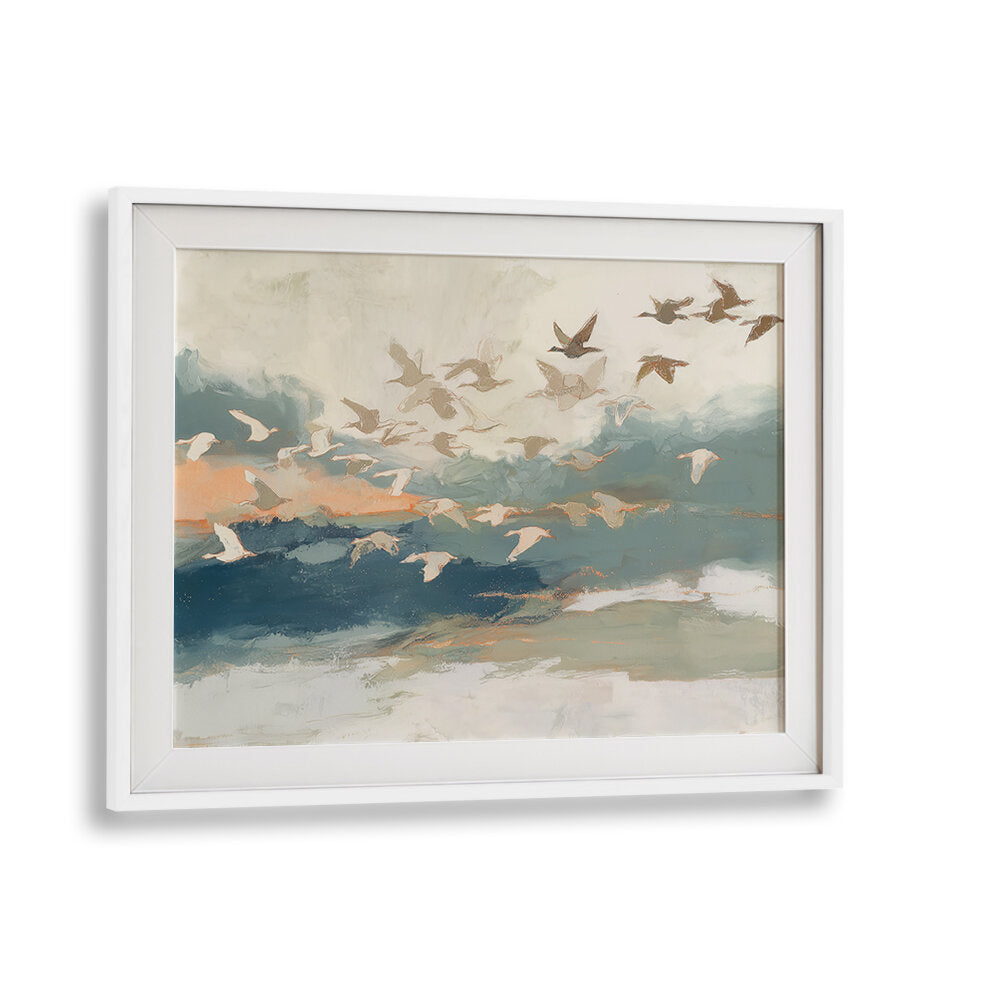 BIRDS IN FLIGHT AT DUSK OVER OPEN WATER