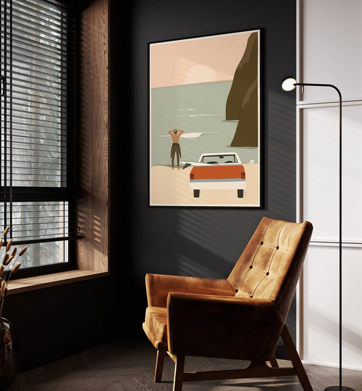 Waiting For The Wave By Andi Bell Beach Prints in Black Plain Frame on a grey wall placed beside an orange sofa