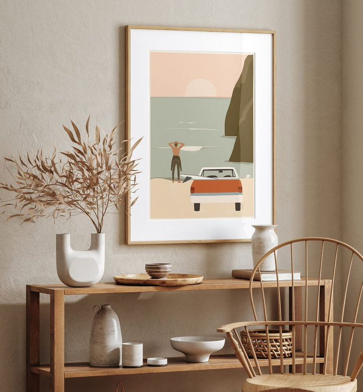 Waiting For The Wave By Andi Bell Beach Prints in Oak Wood Frame With Mount on a beige wall placed above a table