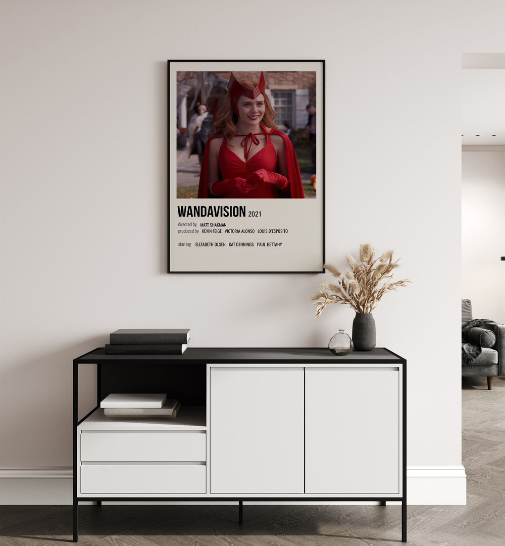 Wandavision Movie Posters in Black Plain Frame placed on a white wall behind a black and white table