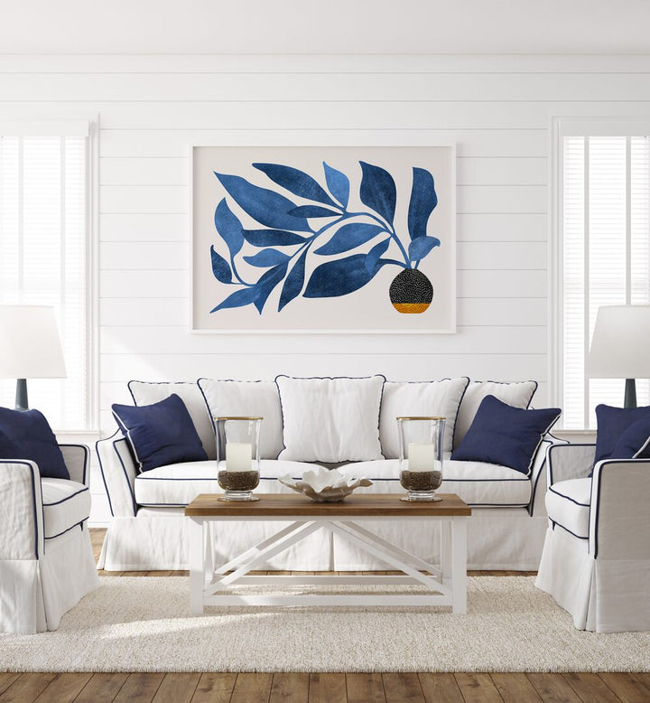 Wandering Ivy in Blue by Kristian Gallagher Botanical Flower Paintings Floral Paintings in White Plain Frame placed on a white wall behind a sofa for living room