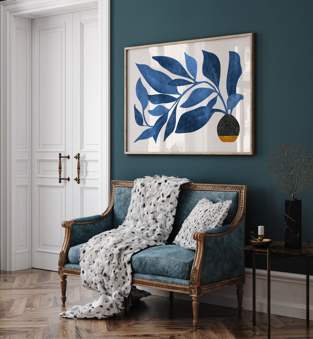 Wandering Ivy in Blue by Kristian Gallagher Botanical Flower Paintings Floral Paintings in Oak Wood Plain Frame placed on a wall behind a sofa and beside a door