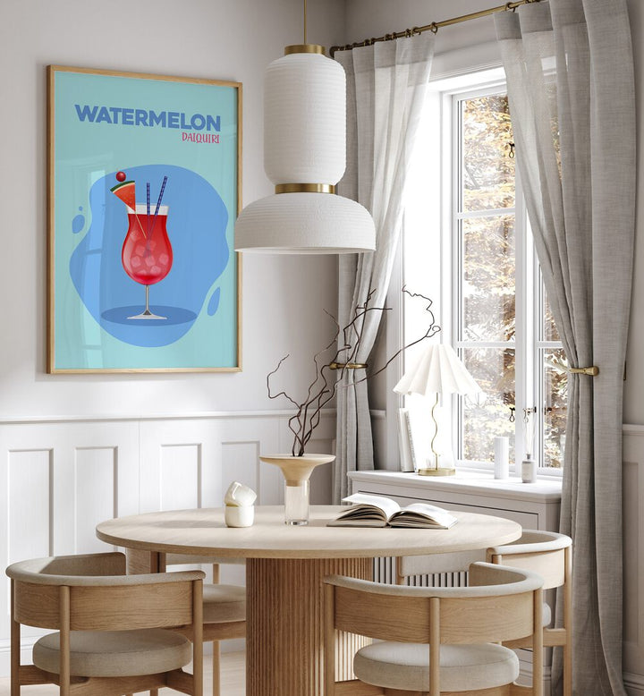 Watermelon Daiquir Cafe Art Prints Cafe Posters in Oak Wood Plain Frame placed on a wall in a dining room area beside a window and behind a dining table