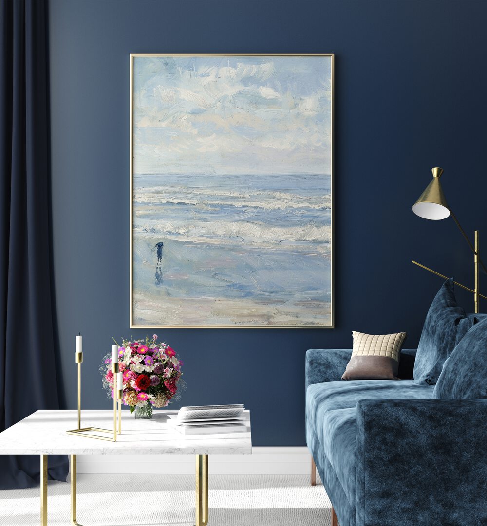 Wave Wander Beach Prints Coastal Wall Art in Gold Plain Frame placed on a Blue Colored Wall in the Living Room