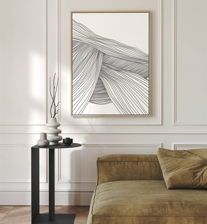 Waves By Dan Hobday Abstract Art Abstract Paintings in Oak Wood Floater Frame placed on a Cream Colored Wall near a Brown Sofa in the Living Room