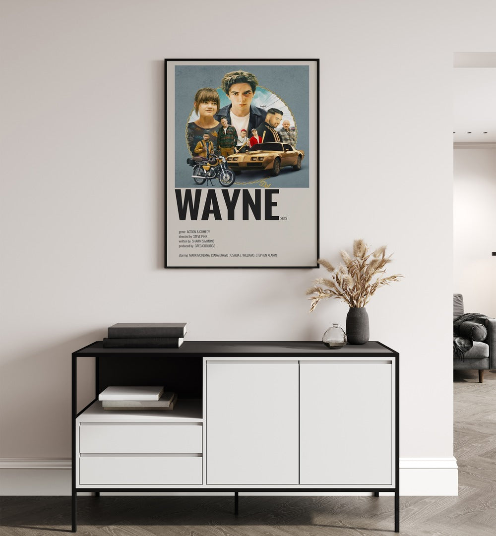 Wayne 2019 Movie Posters in Black Plain Frame placed on a white wall behind a table