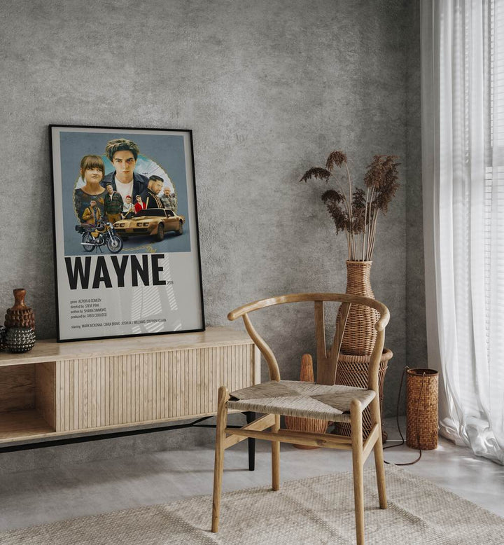 Wayne 2019 Movie Posters in Black Plain Frame placed on a console table behind a chair