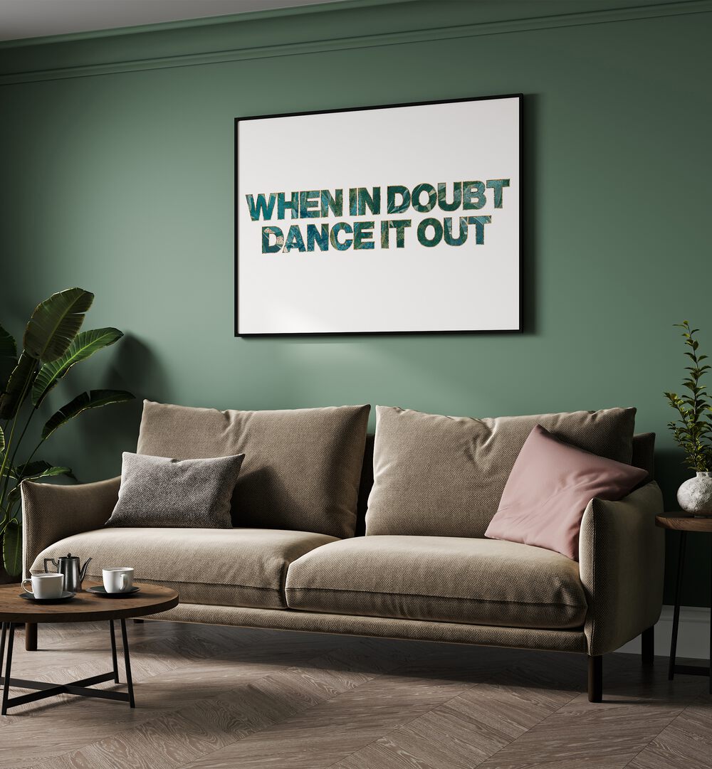 When In Doubt Dance It Out By Sarah Manovski Quotes and Typography Poster in Black Plain Frame placed on a green wall behind a sofa for living room