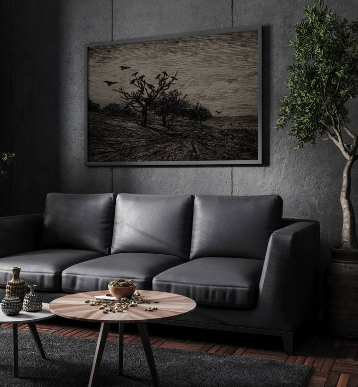 Whispers Among Pines  Gothic Wall Art Prints in Black Plain Frame hanging on a wall above black leather couch beside a plant.