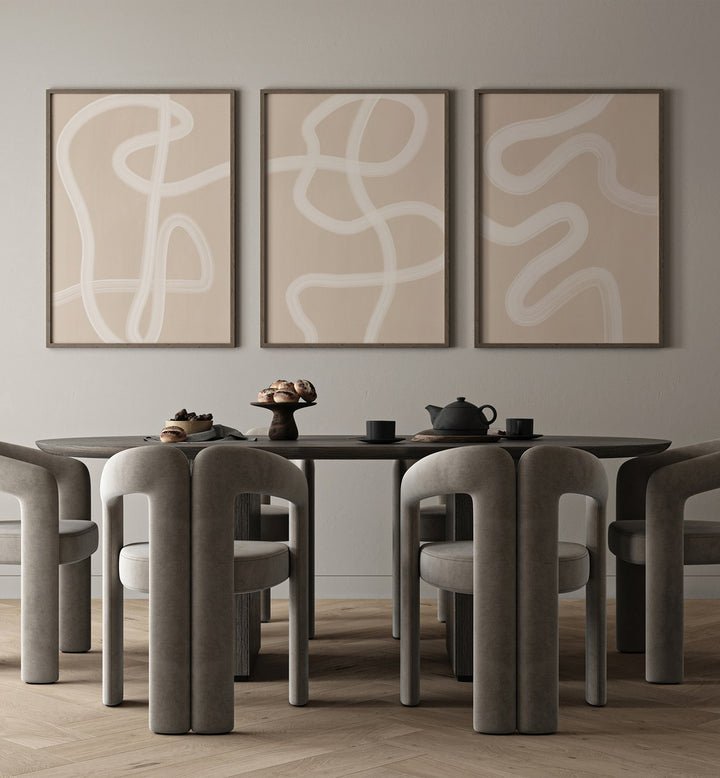 White Brush Strokes Set Of 3 Paintings in Black Plain Frame placed on a dining room wall behind a dining table